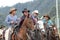 Group of cowboys riding their horses in Ecuador
