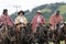 Group of cowboys wearing traditional ponchos