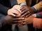 Group of coworkers huddling hands top view