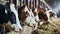 Group of cows at cowshed eating hay or fodder on dairy farm