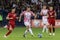 Group of Croatian soccer players compete in a thrilling match on a grassy field in Armenia