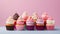 A group of cupcakes situated on a high-quality, gradient multicolour backdrop