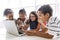 Group of curious children watching stuff on the laptop screen