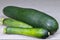 A group of cut fresh zucchini in the skin on a light table