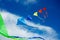 Group of cute colorful kites fly over blue sky and clouds