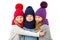 Group of cute kids in winter warm hats and scarfs on white. Children winter clothes