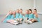 Group of cute little ballet dancers having fun at dance school class.