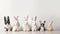 Group of cute little dogs with bunny ears on table indoors. Easter celebration. Banner.
