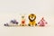 Group of cute small toy figures of children cartoon characters on light beige