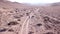 A group of cyclists ride on the steppe.