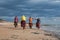 Group of cyclists riding sandy beach bike