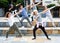 Group of dancing teenagers posing at street. Hip hop dancers