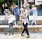 Group of dancing teenagers posing at street. Hip hop dancers