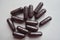 Group of dark purple capsules of bilberry extract