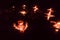Group of decorated Diya Oil Lamp lit in festival season of Diwali on black background. Concept of removing darkness
