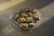 Group of delicious sweet Christmas honey gingerbread cookies on wooden table on trasparent glass plate, various shapes