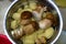 Group delicious white mushrooms on wooden table, partially chopped