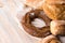 Group of different breads on a light wooden background