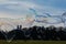 Group of Differently Sized Bubbles Floating Top of Munich Landscape