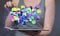 Group of digital colorful cubes and lines floating above a tablet - a big data concept