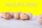 Group of dirty chicken eggs on gray background, with shadows and text poultry eggs on yellow background. Healthy food