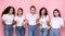 Group Of Discontented Multiracial Ladies Looking At Camera, Pink Background