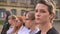 Group of diverse beautiful caucasian women standing along in profile staying in line on the street