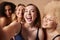 Group Of Diverse Body Positive Women Friends In Underwear Posing For Selfie On Mobile Phone