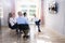 Group Of Diverse Businesspeople Video Conferencing In Boardroom