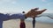 Group of diverse female friends practicing yoga at the beach