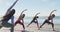 Group of diverse female friends practicing yoga at the beach