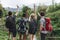 Group of diverse friends hiking through a jungle