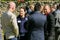 Group of diverse individuals engaged in conversation at a corporate networking event