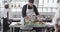 Group of diverse male chefs preparing meals in kitchen, slow motion