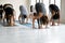 Group of diverse people practicing yoga doing Forward Bend Uttanasana