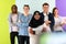 group of diverse teenagers posing in a studio, determined teenagers in diverse clothing.