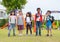 Group of diversity school children playing at playground in kind