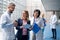 Group of doctors talking to pharmaceutical sales representative.