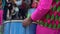 A group of drummers playing rhythmic music during the parade at the carnival. Dressed in colorful traditional costumes.