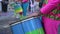 A group of drummers playing rhythmic music during the parade at the carnival. Dressed in colorful traditional costumes.