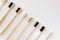 Group of eco bamboo toothbrushes, on white background.