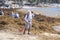 Group of ecological volunteers clean the beach