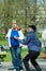 A group of elderly people doing health and fitness gymnastics in the park. Old people do