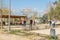 Group of elderly people playing a game of petanque in a public park