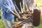 Group of elderly are rotating meat and vegetable on a stick