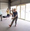 Group of elderly senior people practicing Tai chi class in age care gym facilities