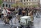 Group of elegant cycling people wearing old fashioned tweed clothes