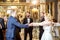 Group of elegant people dancing indoors