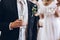 Group of elegant people holding glasses of champagne at luxury w