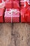 Group of elegant red gift box decoration on wood background, vibrant valentine lovely present concept